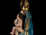 a statue of a woman holding a baby in her arms