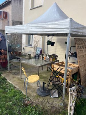 a white tent that is set up in the yard