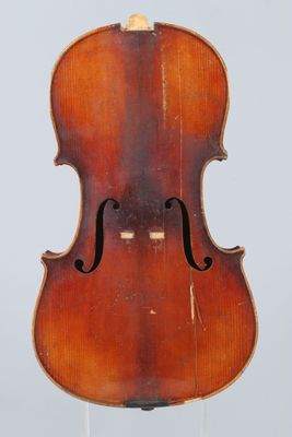 an old violin on a stand against a white background