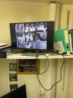 a desk with a monitor and a laptop on it