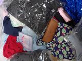 a bag of clothes and other items in a plastic bag