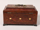 an antique wooden box with brass hardware on top of a white background