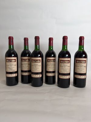 six bottles of wine are lined up in a row on a table