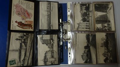 a lot of old black and white photos in a binder