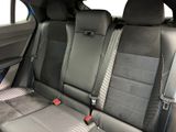 two seats in the back of a car that are black