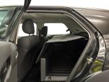 a car with the door open and the driver ' s seat down