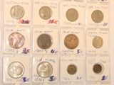 a lot of different coins in a display case