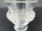 a clear glass vase sitting on top of a table