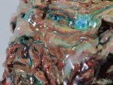 a close up of a ceramic sculpture of a man ' s face