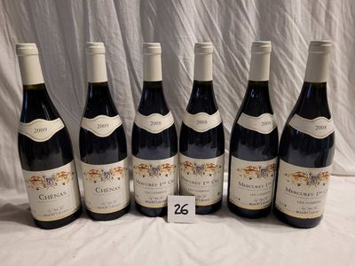 six bottles of red wine are lined up on a table