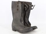 pair of vintage black leather boots on white background