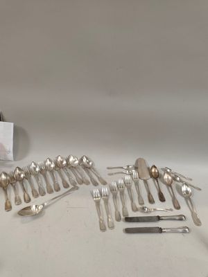 a lot of silver spoons and spoon knives on the table