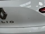 a close up of the emblem on the back of a white car