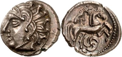 a silver coin with an image of a horse and a man on it