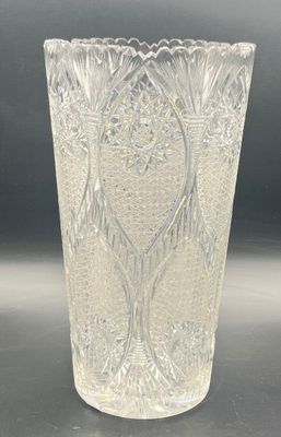 a clear glass vase with a design on it
