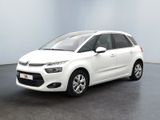 La Citroën blanche est garée dans une grande pièce