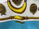 a white and blue table cloth with gold decorations on it