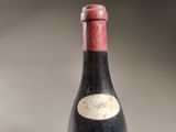 a bottle of wine that is sitting on a table