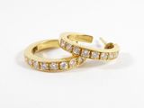 a pair of yellow gold hoop earrings with diamonds