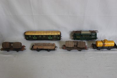 several toy trains are lined up next to each other on a white surface