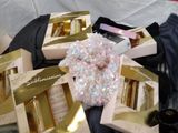 a lot of different types of perfumes in the box