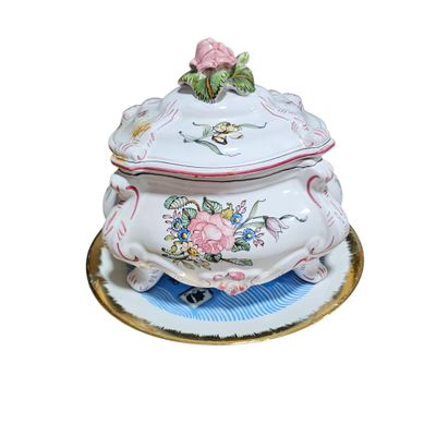 an image of a fancy tureeny dish with a rose on top