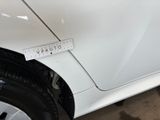 a sticker on the side of a white car with a sticker on it