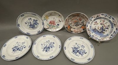 six blue and white plates with floral designs on them on a table