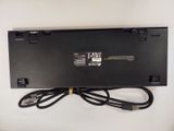 the back of a laptop with a power cord attached to it