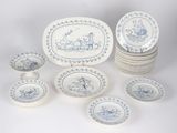 a lot of plates and bowls that are sitting on a table