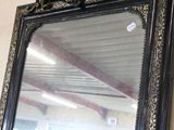 a mirror hanging on the wall in a room
