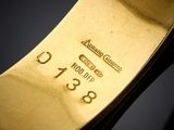 an image of a close up of a gold plated watch