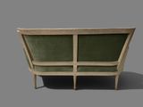 an image of a green couch sitting on top of a gray floor