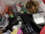 a basket full of items that are sitting on the floor