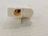 a close up of a white electrical plug on a table
