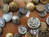 a lot of buttons that are on a table