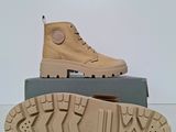the sole of a pair of tan boots on top of a box
