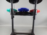 a black stand with three different colored discs on it