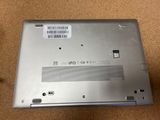 a silver laptop with a bar code on the back of it