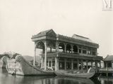 a boat that is sitting in the water next to a building
