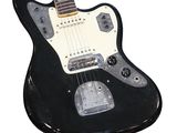 an image of a black electric guitar sitting on top of a white surface