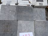 a lot of boxes of cement sitting on a pallet
