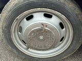 a close up of a tire on a red car