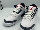 a pair of white and black sneakers on a white surface