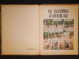 an open book with a picture of a man and a dog on it