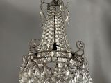 a close up of a crystal chandelier hanging from a ceiling