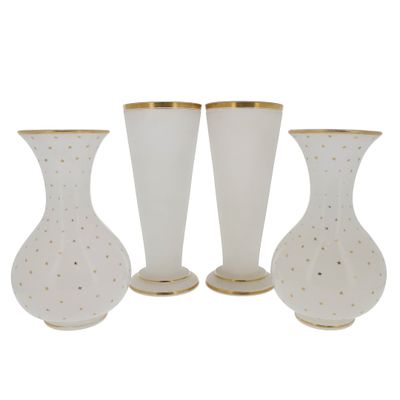 three white vases with gold rims and a gold rim