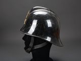 an image of a helmet on a mannequin head on a gray background