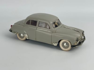 a toy car that is sitting on a white surface