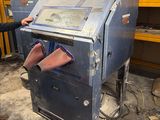 a man that is standing next to a machine